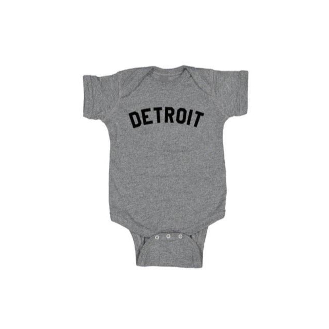 Gray baby onesie with 'DETROIT' printed on it against a white background