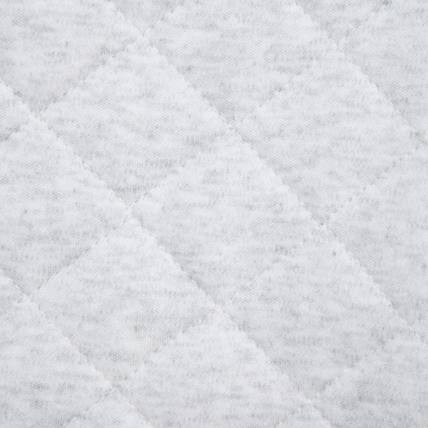 Close-up of a textured gray fabric with diamond pattern