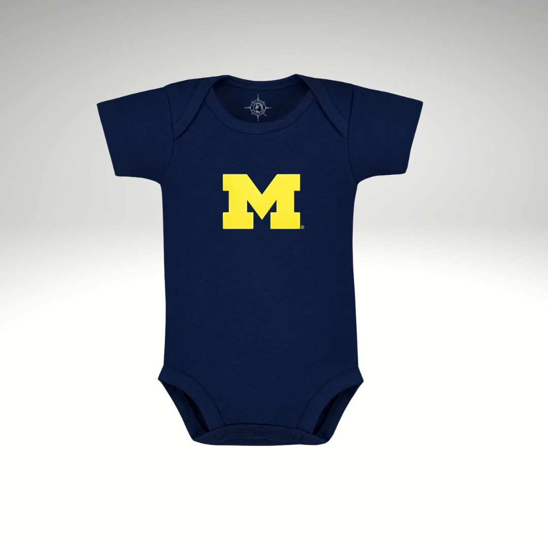 Navy blue baby onesie with a yellow 'M' on a light gray background