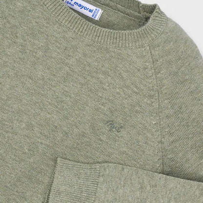 Green sweater with a pocket and visible brand label on a light gray background