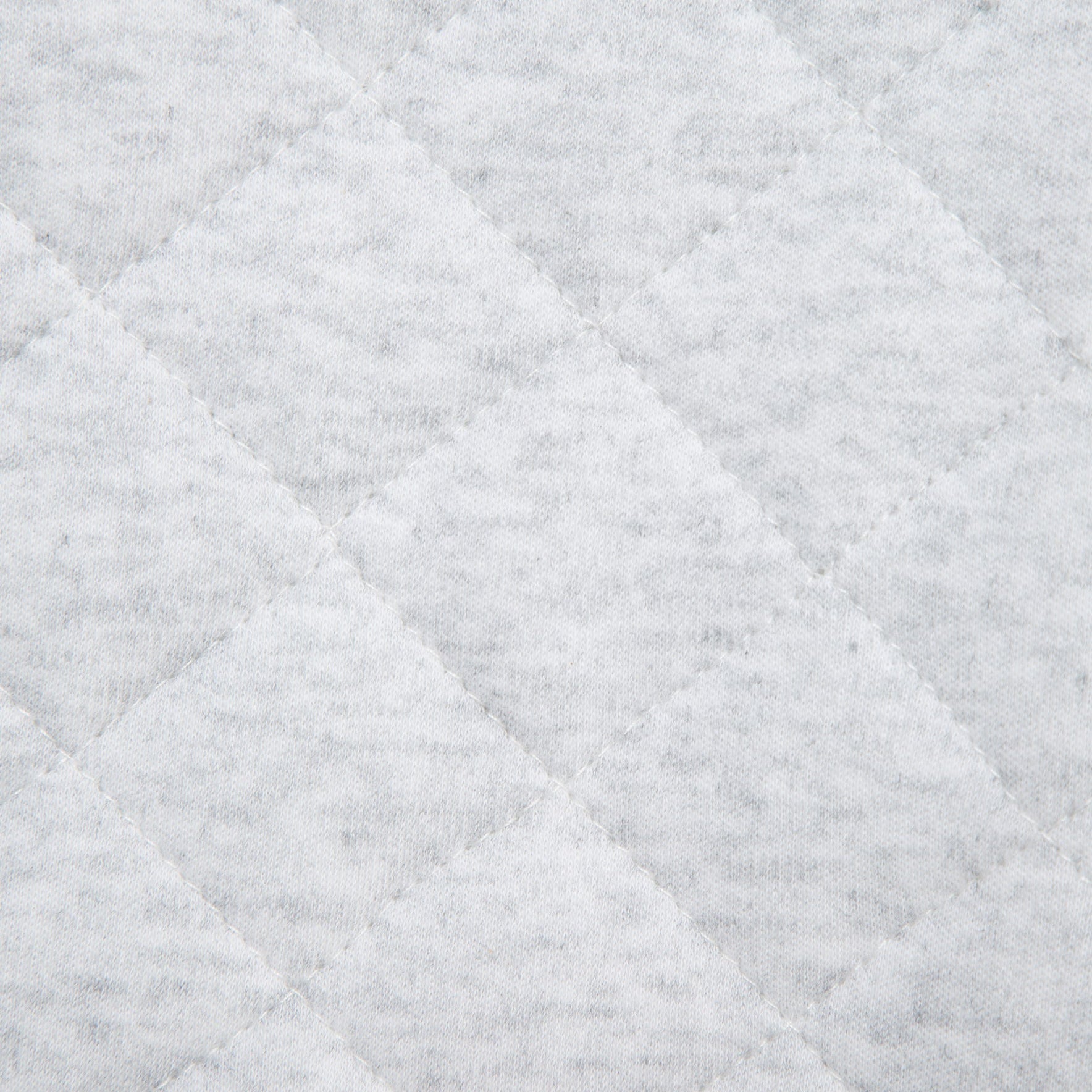 Close-up of a textured gray fabric with diamond pattern