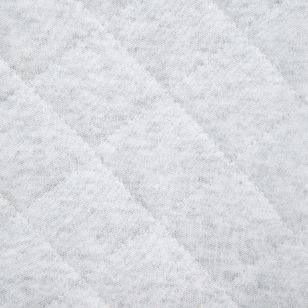 Close-up of a textured gray fabric with diamond pattern