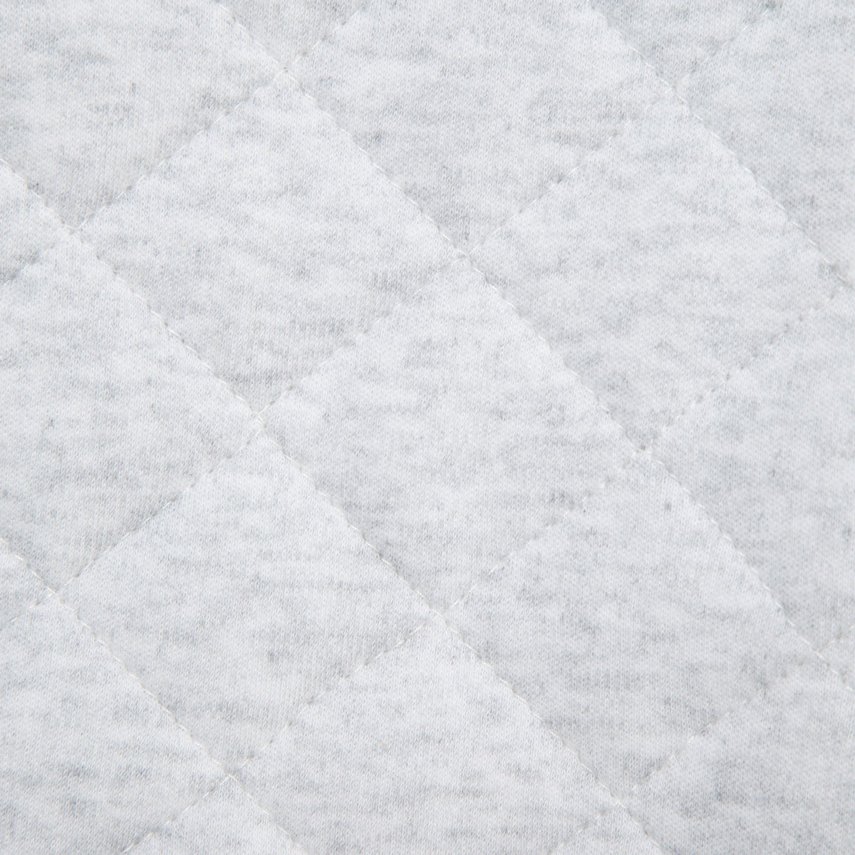 Close-up of a textured gray fabric with diamond pattern