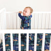 baby in crib with sleep bag