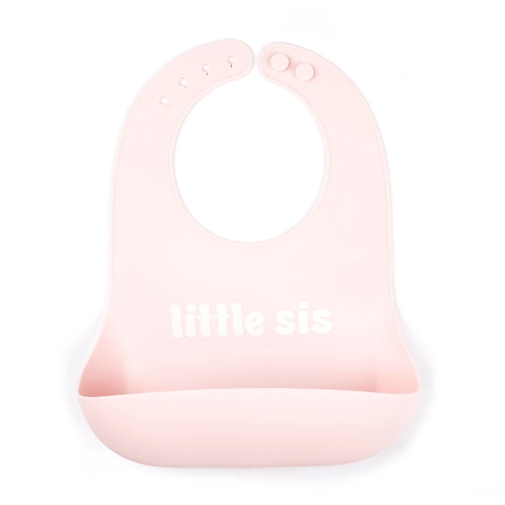 pink bib with words: lil sis