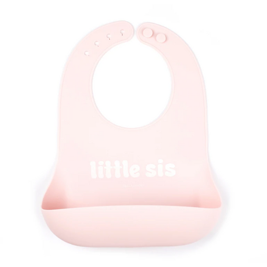 pink bib with words: lil sis