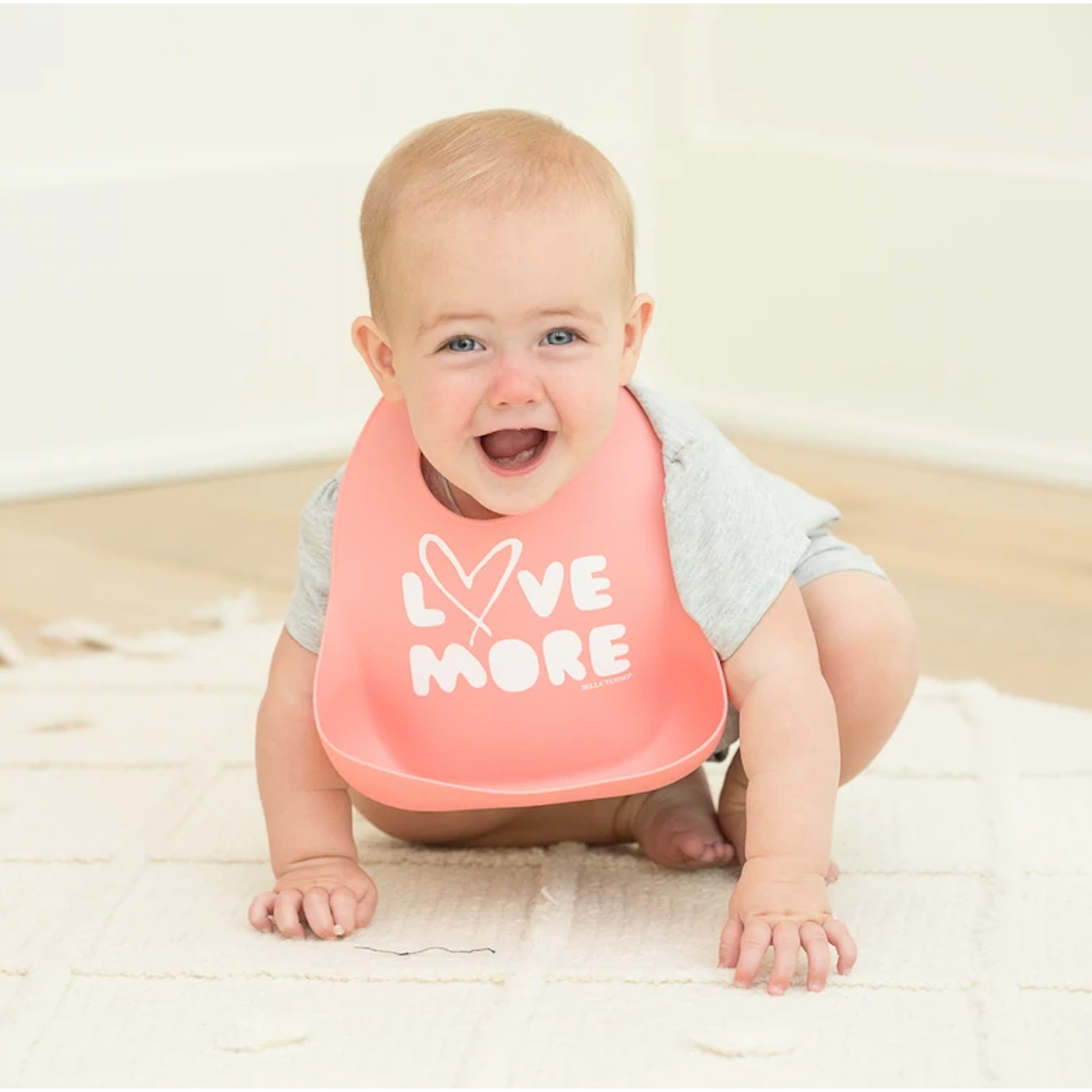 pink bib with words: Love More