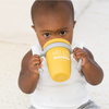 boy using yellow sippy cup