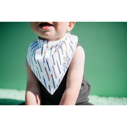 baby in confetti bib