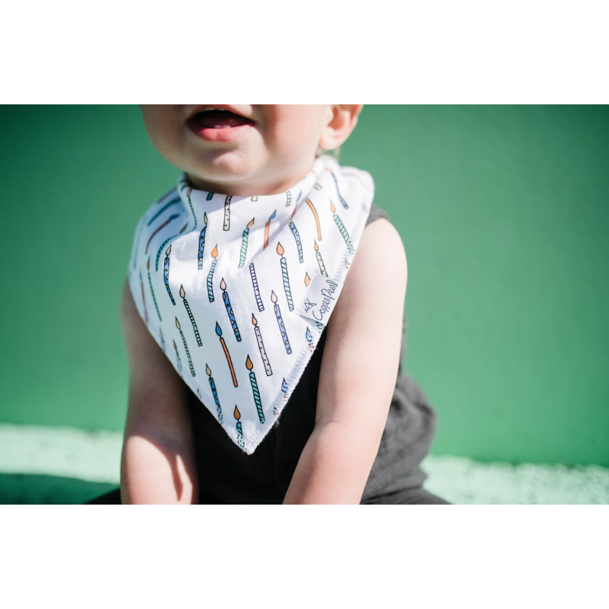 baby in confetti bib