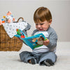 boy playing with taggies book